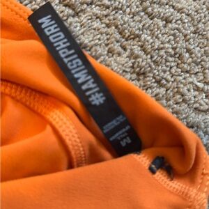 Vibrant Orange Leggings with Durable Fabric and Reinforced Stitching